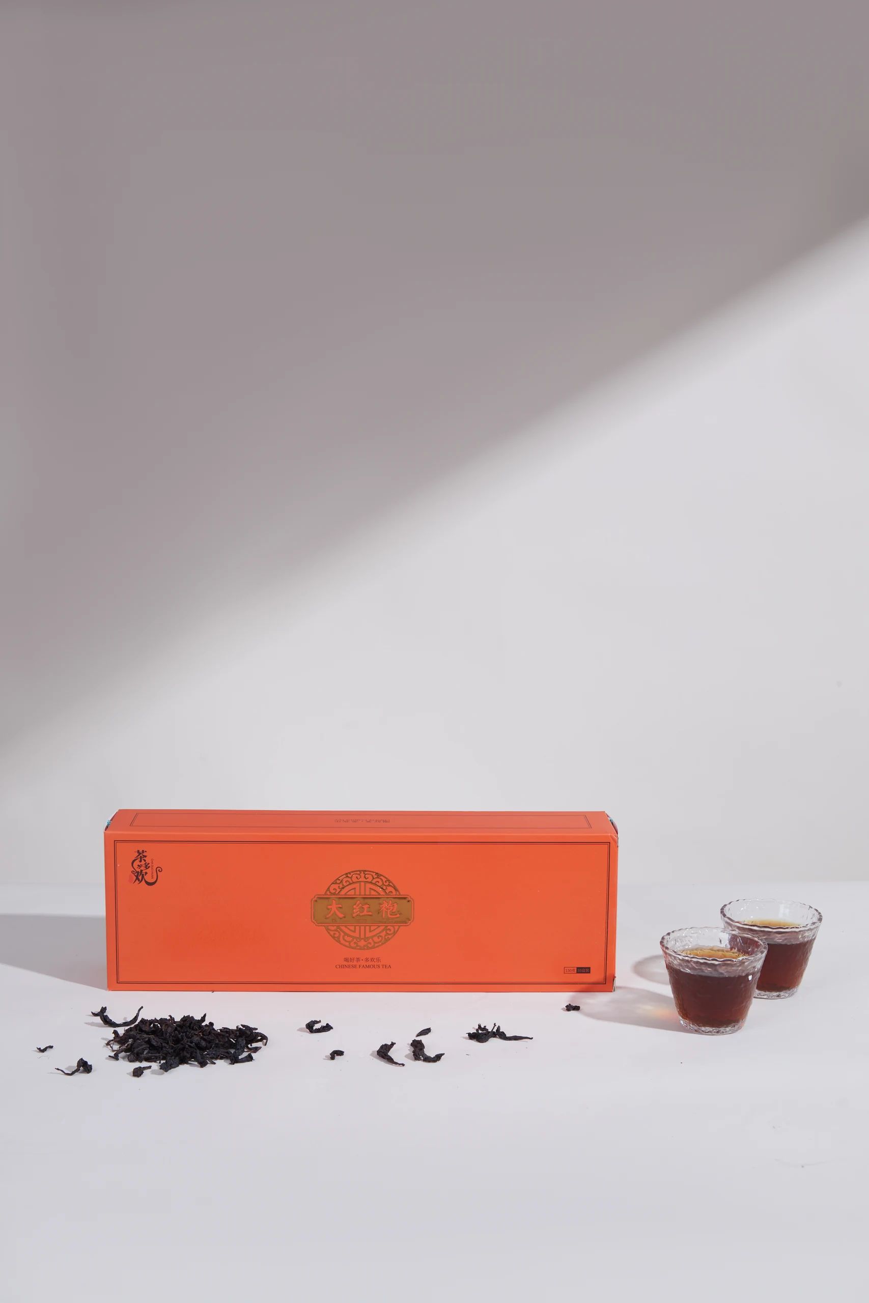 茶叶与橙色包装静物摄影