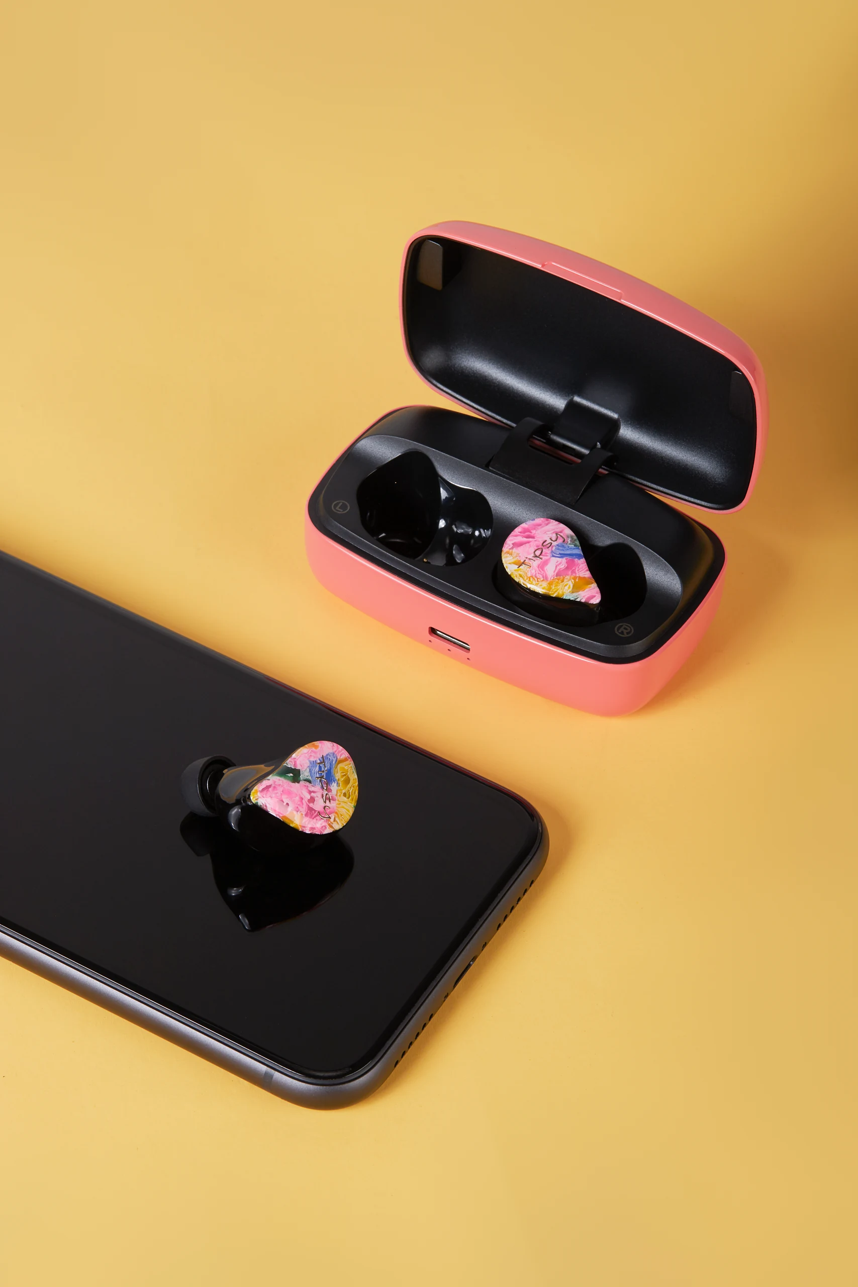 Wireless Earbuds in Colorful Still Life